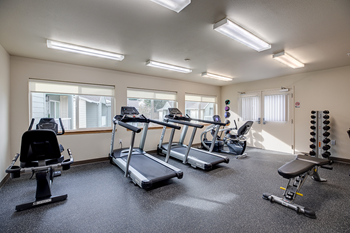 Gym with fitness equipment l Vintage at Napa Senior Apartments - Photo Gallery 12