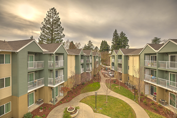 View of exterior of community with grass l Vintage at Napa Senior Apartments - Photo Gallery 3