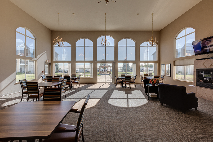 Social Room with Fireplace and Full Kitchen l Richland WA 99352 l Vintage at Richland Senior Apartments For rent