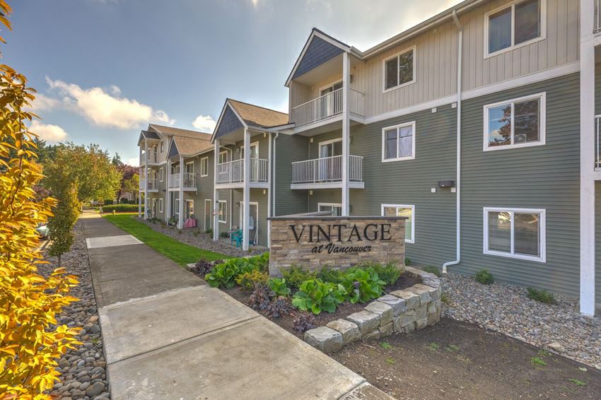 Entry with monument sign l Vintage at Vancouver Senior Apartments - Photo Gallery 1