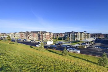View of community with grass area Apts in Longmont, CO | Copper Peak Apartments - Photo Gallery 7