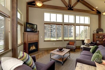 Clubhouse with seating and fireplace Copper Peak Apartments For Rent | Longmont, CO 99337  - Photo Gallery 2
