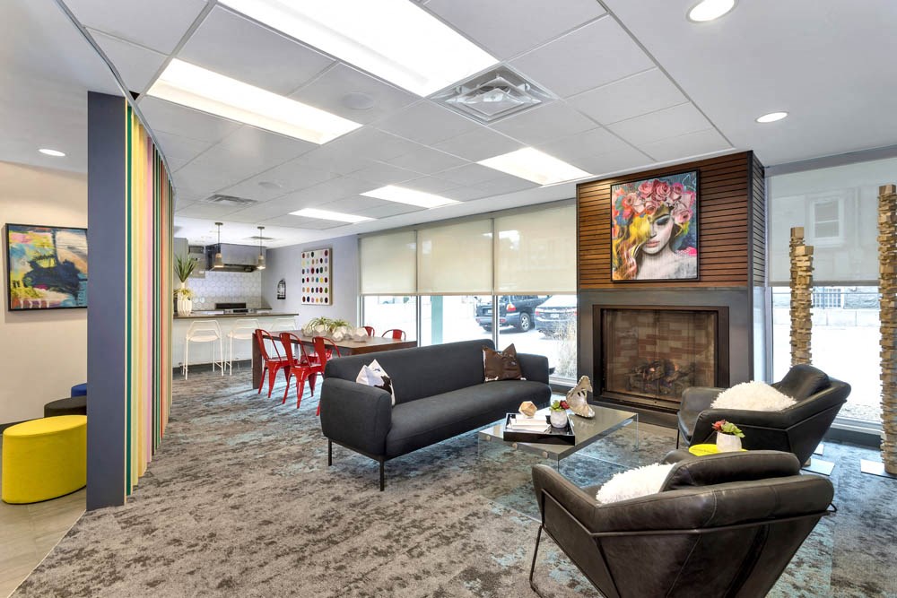 a living room with furniture and a fireplace