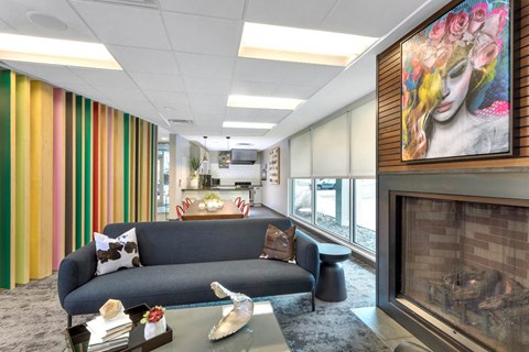 a living room with a couch and a fireplace