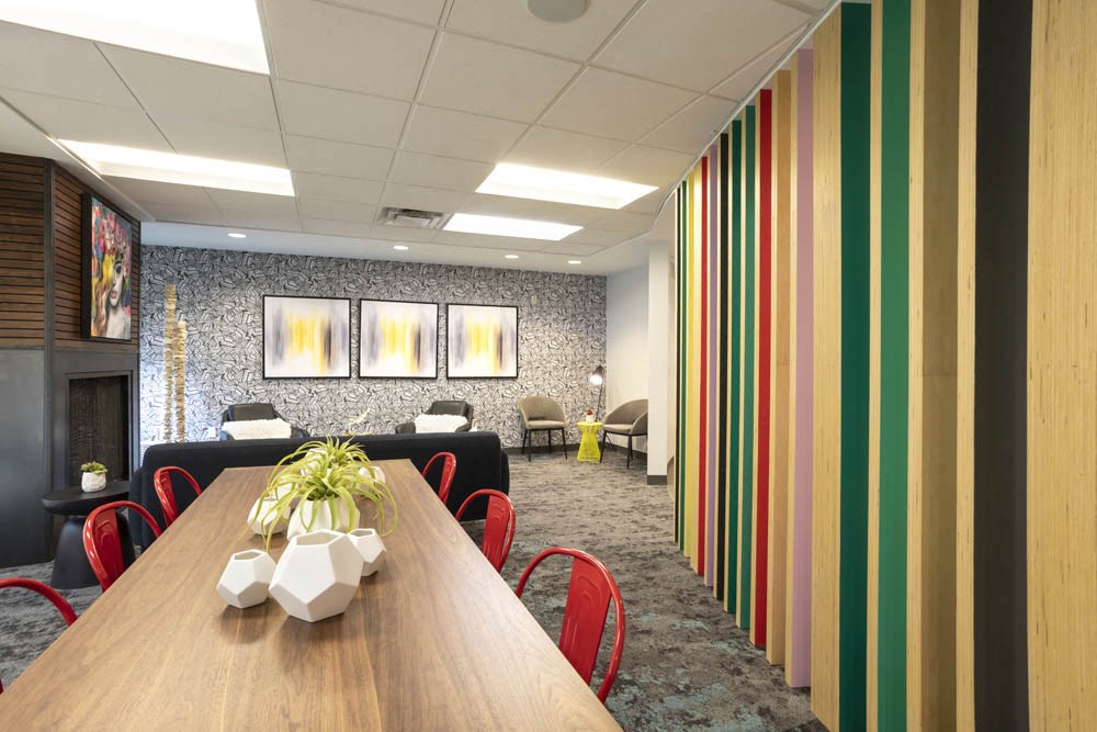 a conference room with a wooden table and chairs