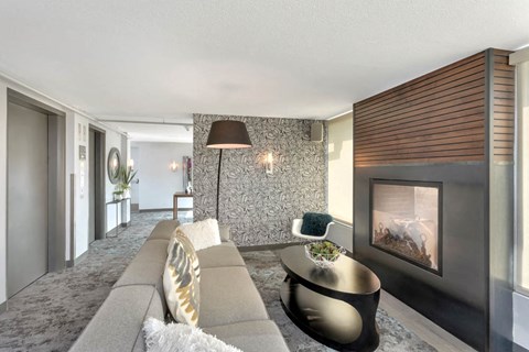 a living room with a couch and a fireplace