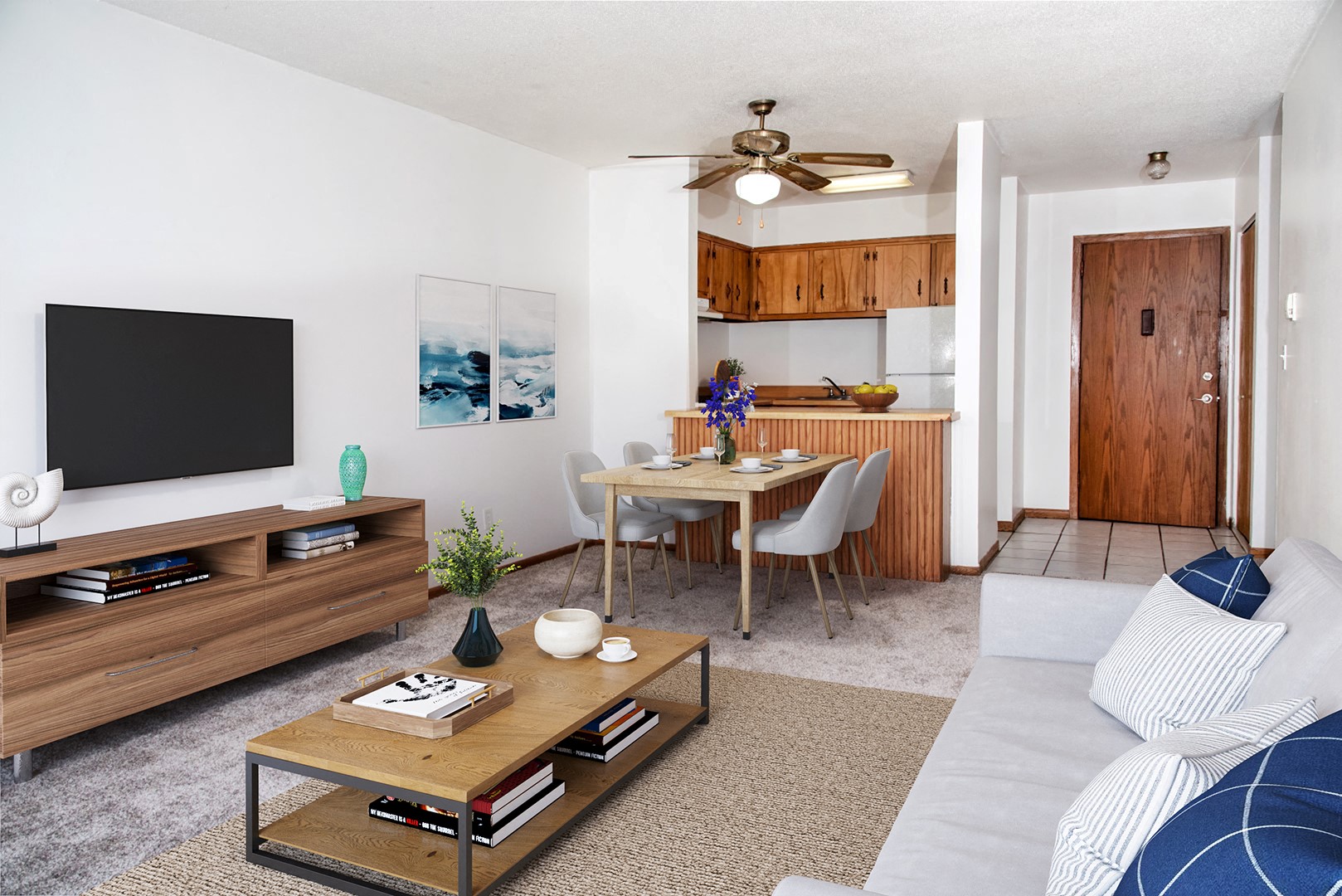 a living room with a couch and a table and a tv