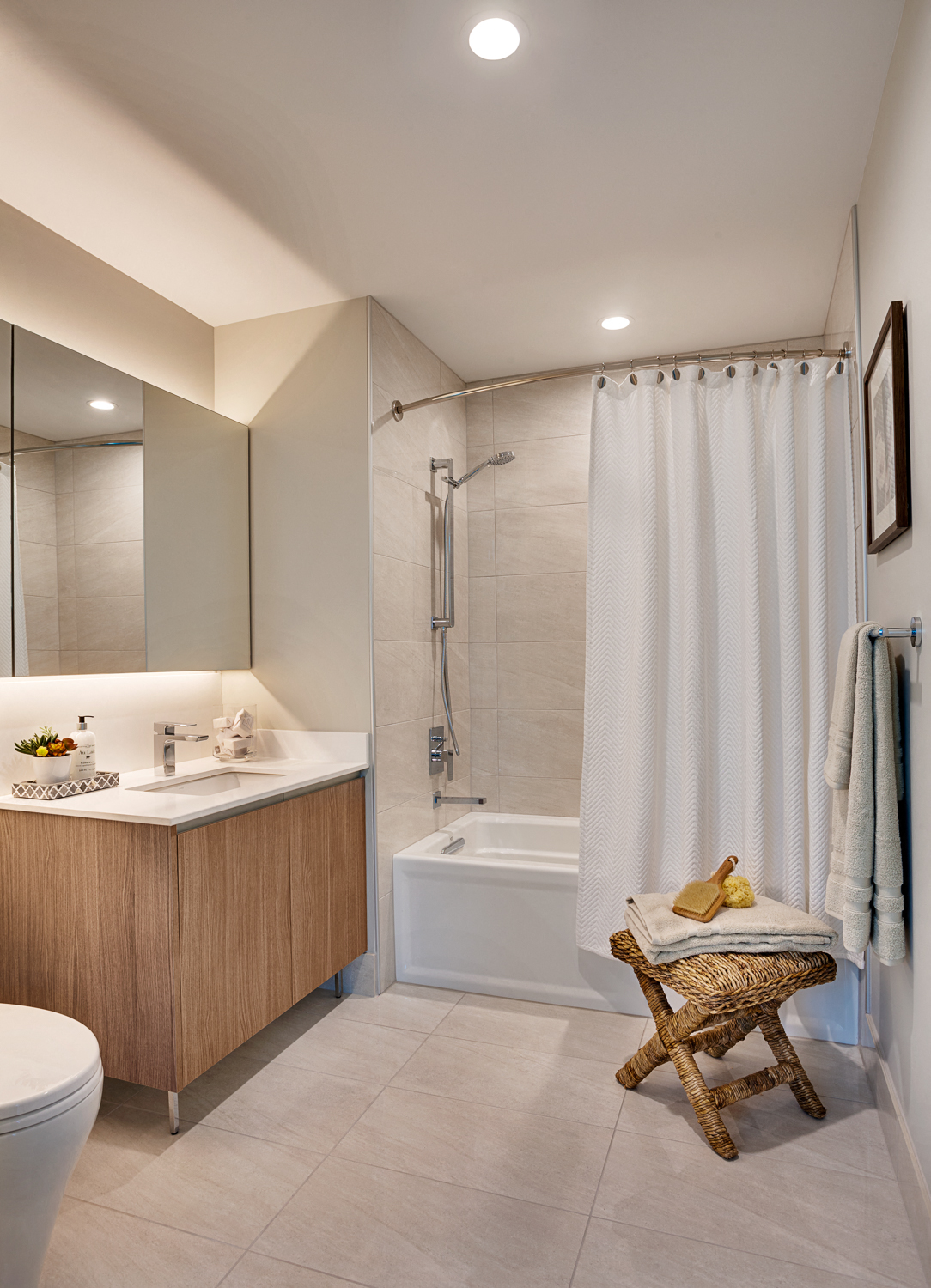 a bathroom with a shower and a sink and a toilet