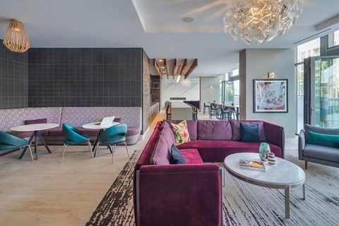 a living room with couches and chairs and a table