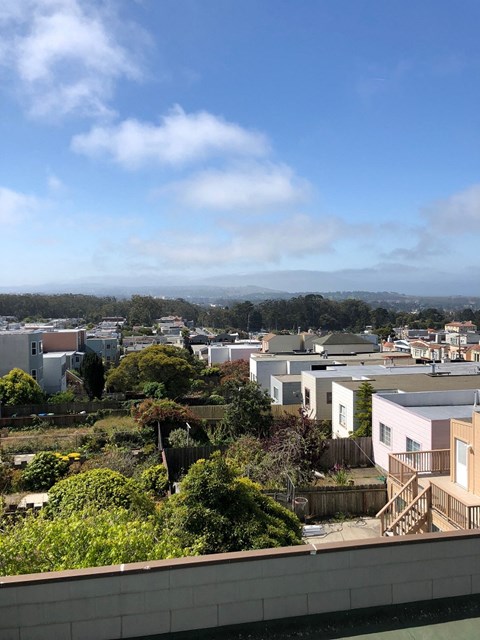 the view of the city from the roof of a building