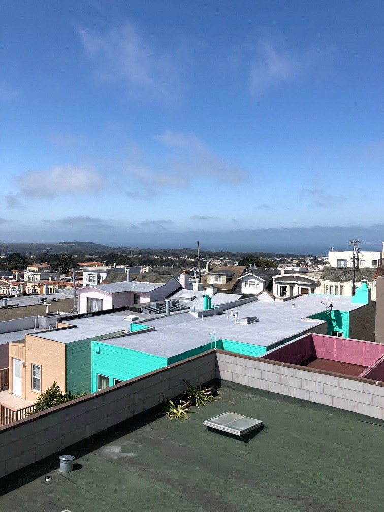 a view of a city from the roof of a building