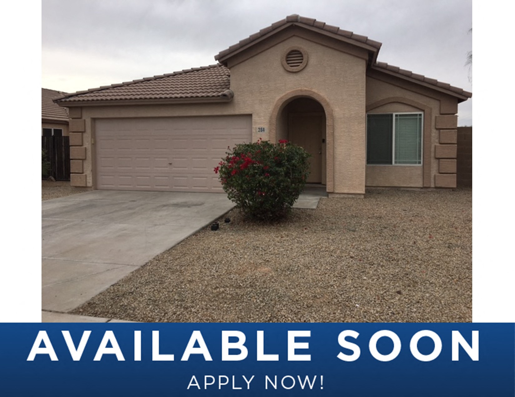 a new house with a garage door and a sign that reads available soon