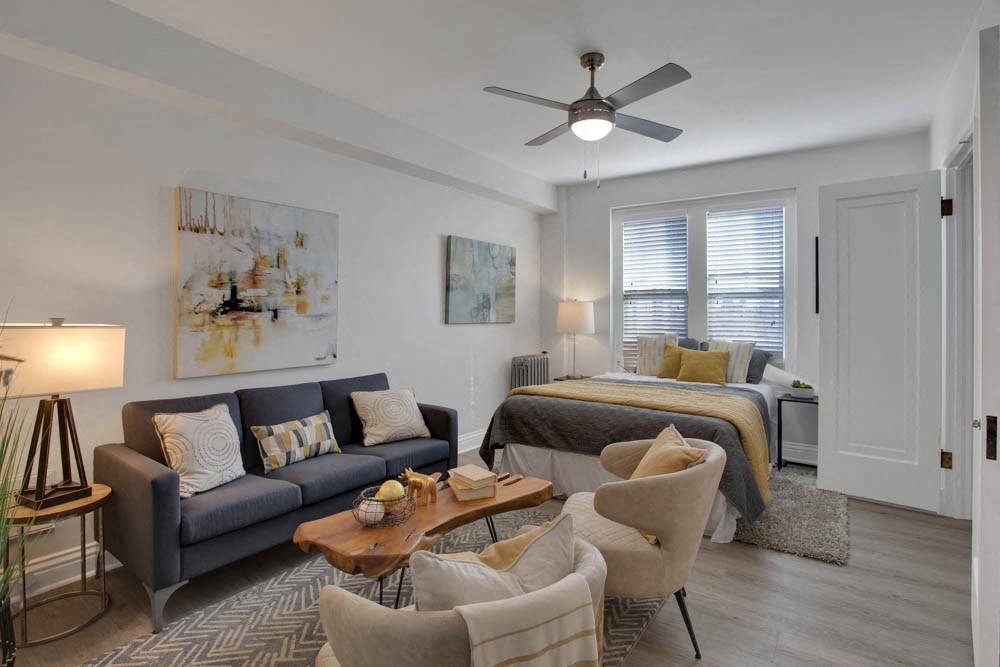 a living room with a couch and a bed
