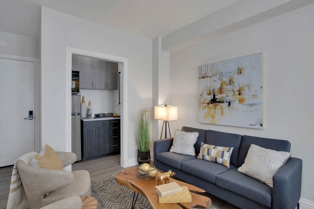 a living room with a couch and a table