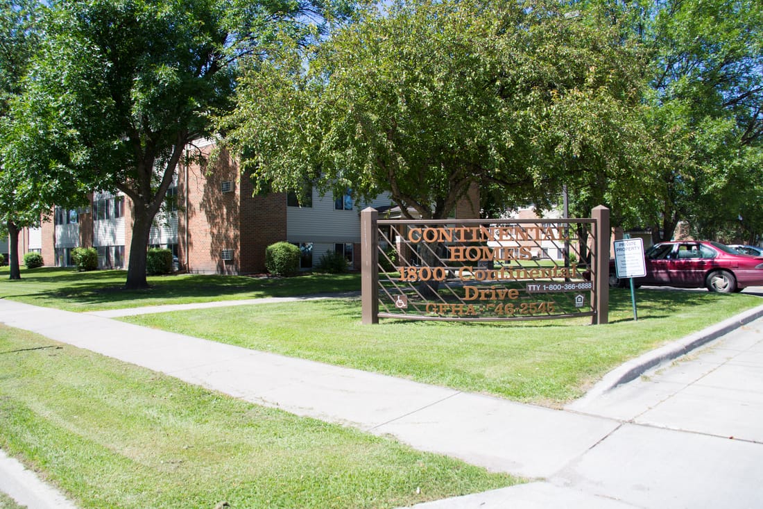 A sign for a gontin home for the aged is in front of a building.