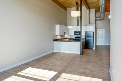 A kitchen with a refrigerator, stove, and oven is shown.