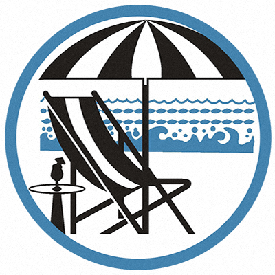 a beach chair with an umbrella and a table