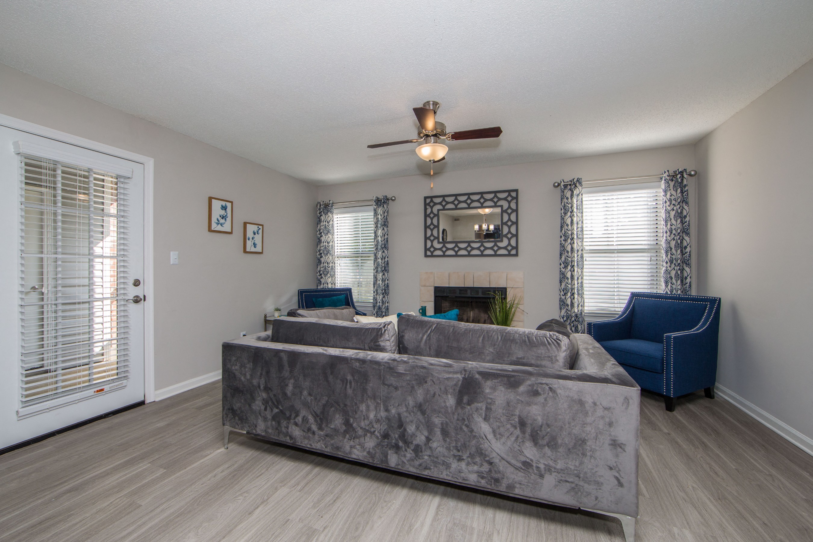 Living room with hardwood floor and natural light at St. Croix Apartments in Virginia Beach VA