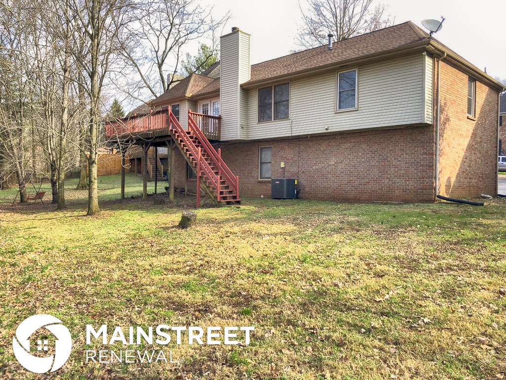 a home with a yard in front of it