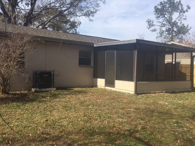 a view of a house with a screened in porch