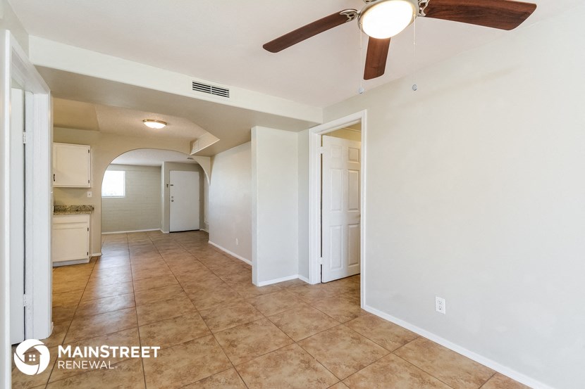 the living room is open to the kitchen and entryway