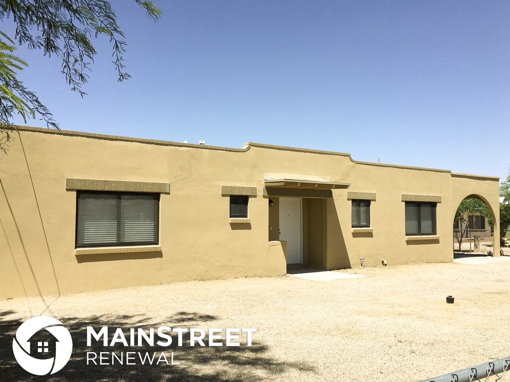 the front of a building with an open door