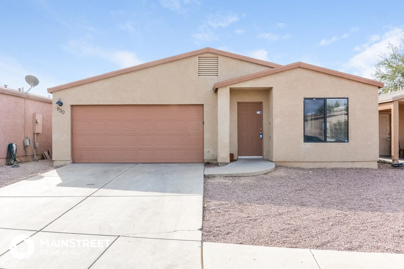 a house with a garage door and a driveway