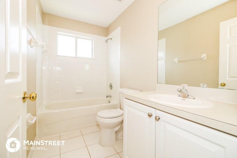 a bathroom with a sink toilet and a shower