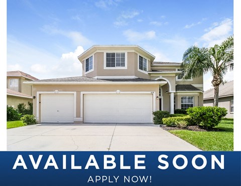 a home with a garage door and a sign that reads available soon