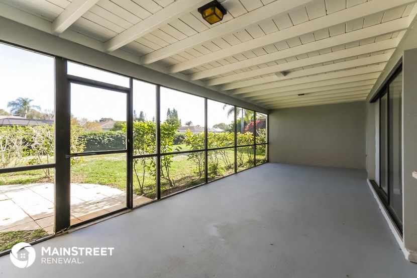 a large room with large windows and a concrete floor