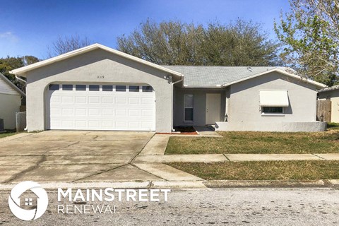 a white house with a white garage door