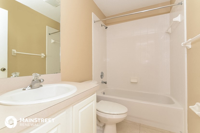 a bathroom with a sink and a toilet and a tub