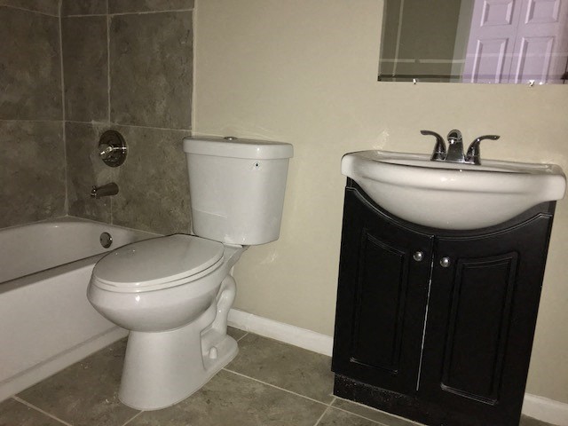 a bathroom with a toilet and a sink