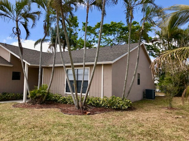 a house with palm trees in front of it