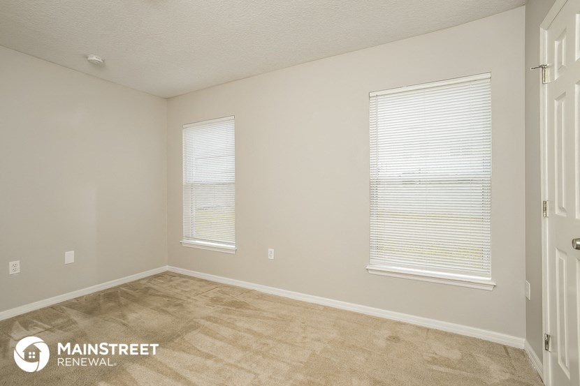 the spacious living room of an apartment at the residence