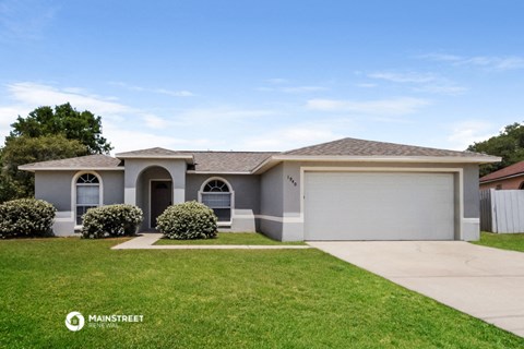 a house with a lawn in front of it