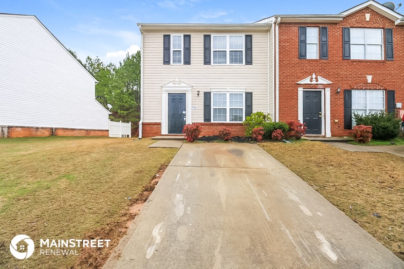 a large house with a driveway in front of it