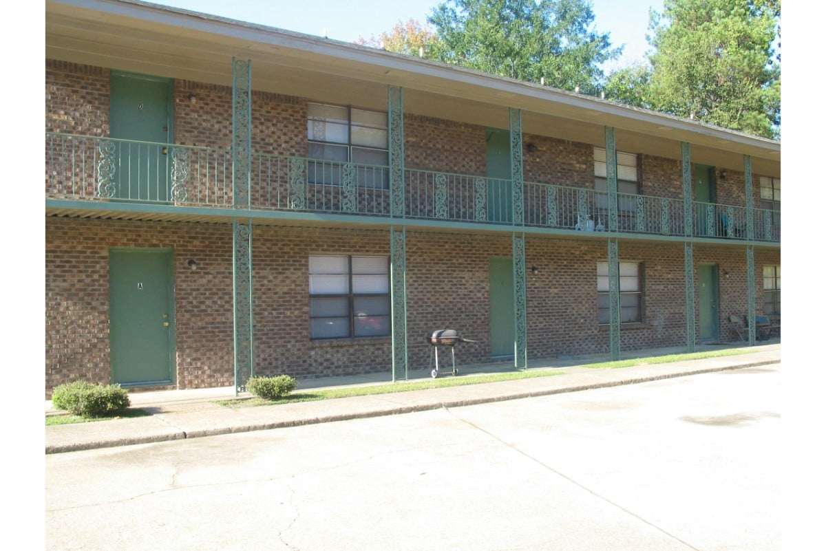 A building with green doors and windows.
