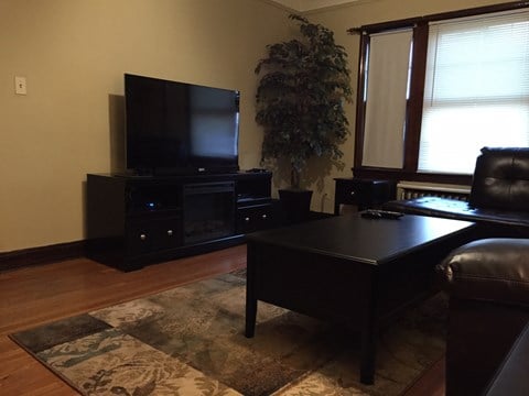 a living room with a tv and a couch