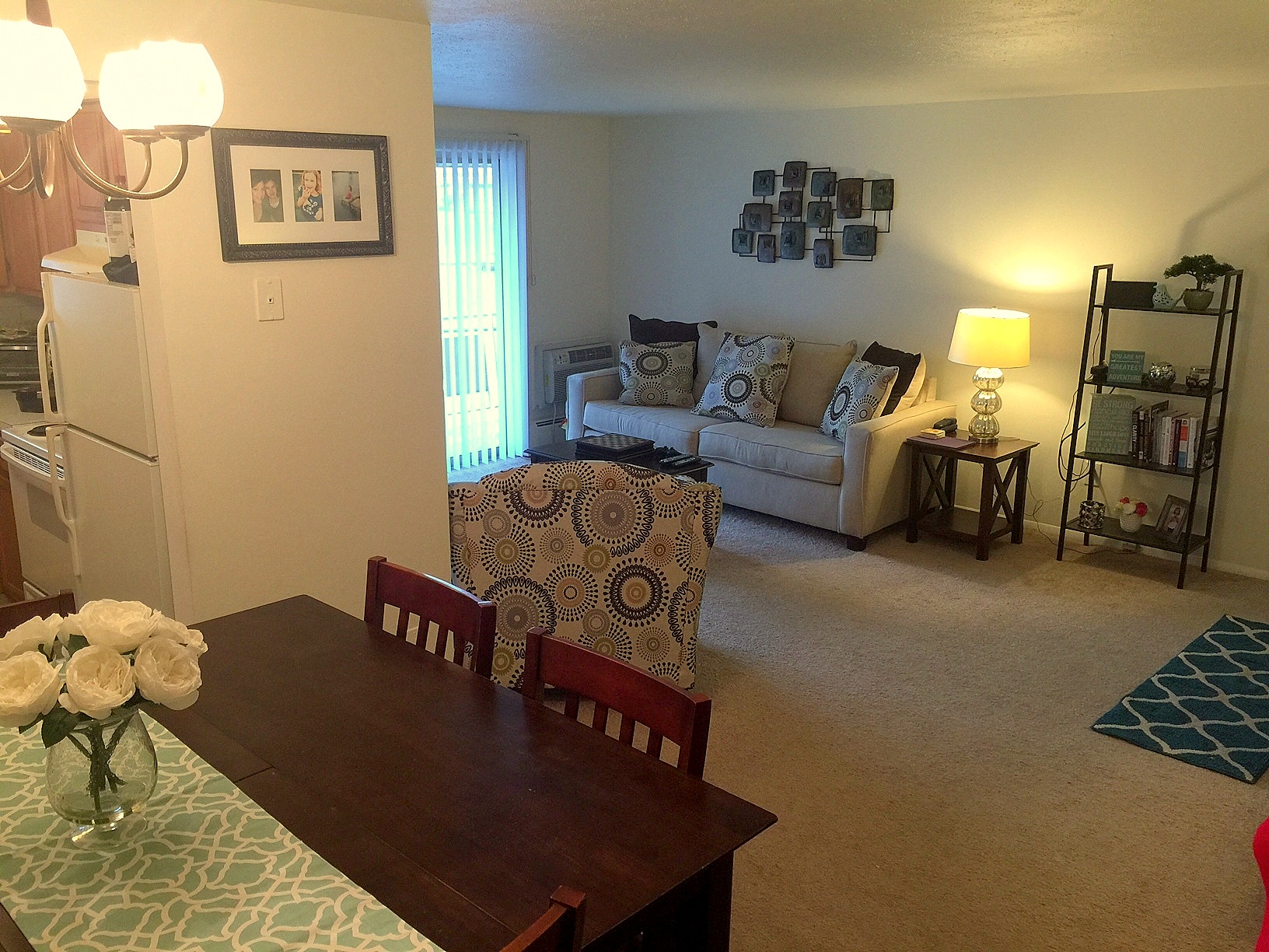 an open living room and dining room with a couch and a table