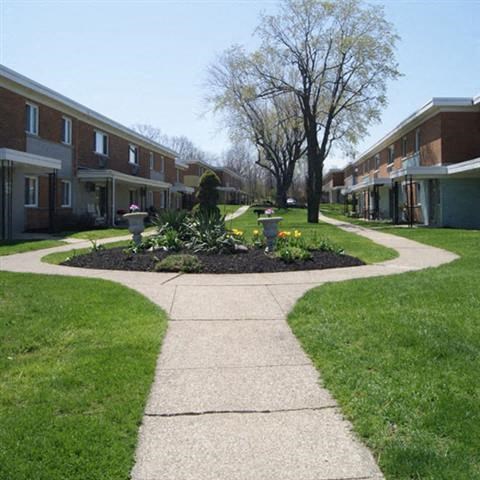 a sidewalk in the middle of an apartment building