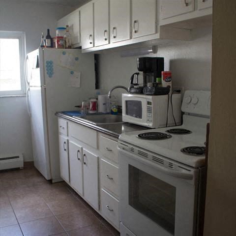 a kitchen with a stove microwave and refrigerator