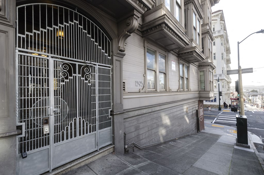 the closed gate of a building on a city street