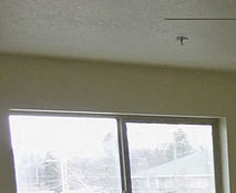 Bedroom Image of a bedroom with AC, base heaters, and windows - Photo Gallery