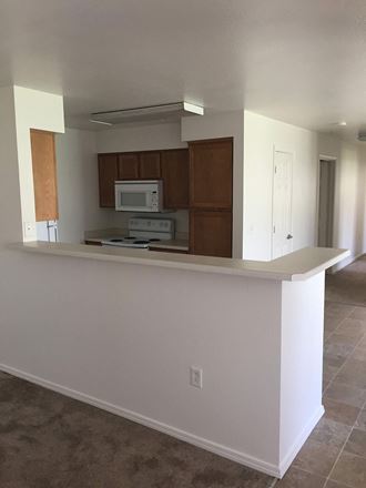Image of microwave, stove, and cabinets