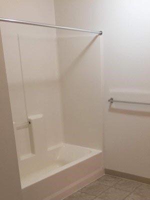 Bathroom Image of bathtub, towel rack and toilet