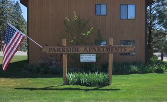 Image of the outside of the building, Parkside sign, and the lawn