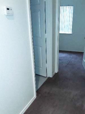 Hallway Image of carpeted hallway, and two doors to bathroom and bedroom - Photo Gallery