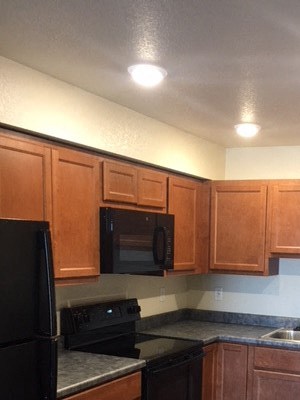 Kitchen Image of refrigerator, microwave, stove, faucet, sink, stove, cabinet, and stove - Photo Gallery 2