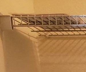 Laundry Room Image of wash machine and dryer and rack above